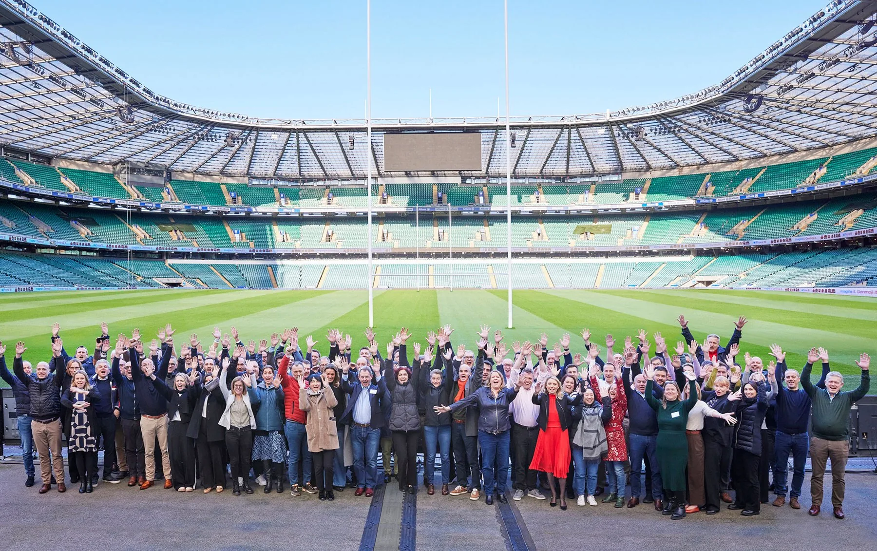 Formal group shot of all attendees on the pitch at Allianz Stadium, Twickenham